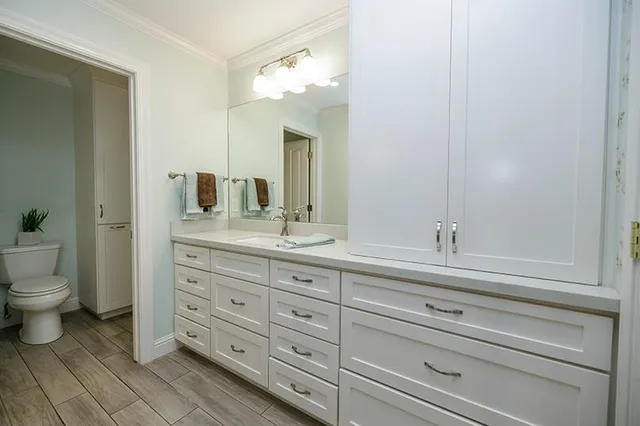 a bathroom with a sink and mirror