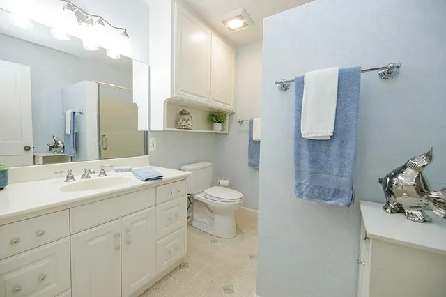 a view of a kitchen with cabinet and a window