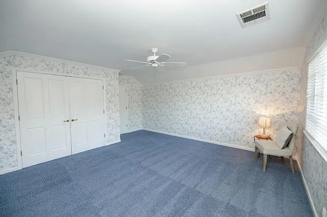 a view of a kitchen cabinets a sink dishwasher and a fireplace