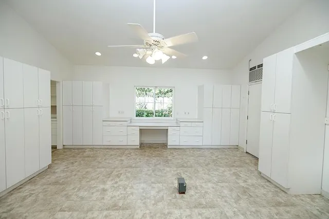 a view of a backyard with plants and a patio