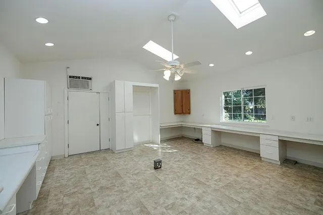 a view of house with garden space and trees