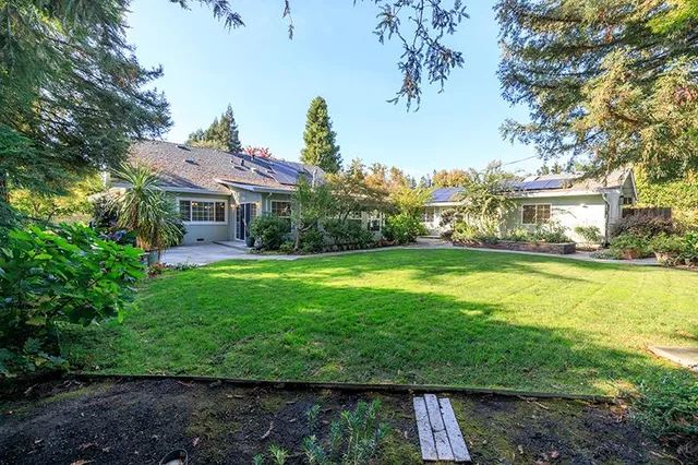 an aerial view of residential house with outdoor space and lake view