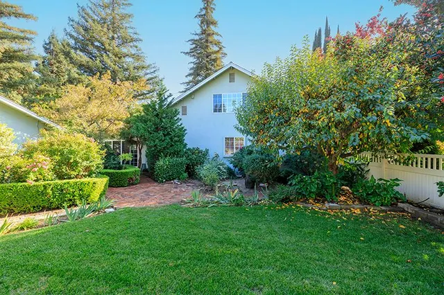 an aerial view of a house with a garden