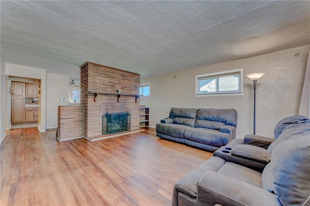 717 Morgantown Road Uniontown, PA 15401 - Photo 12 of 23 a living room with furniture and a fireplace