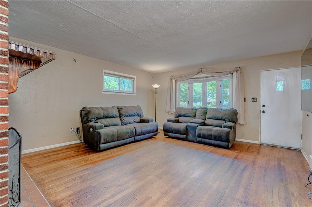 717 Morgantown Road Uniontown, PA 15401 - Photo 13 of 23 a living room with furniture and a wooden floor