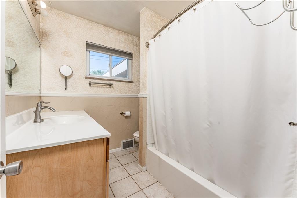 717 Morgantown Road Uniontown, PA 15401 - Photo 15 of 23 a bathroom with a sink and a mirror
