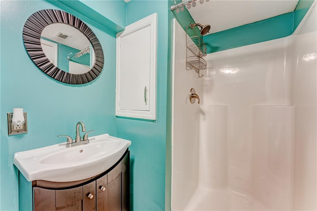 717 Morgantown Road Uniontown, PA 15401 - Photo 22 of 23 a bathroom with a sink and mirror