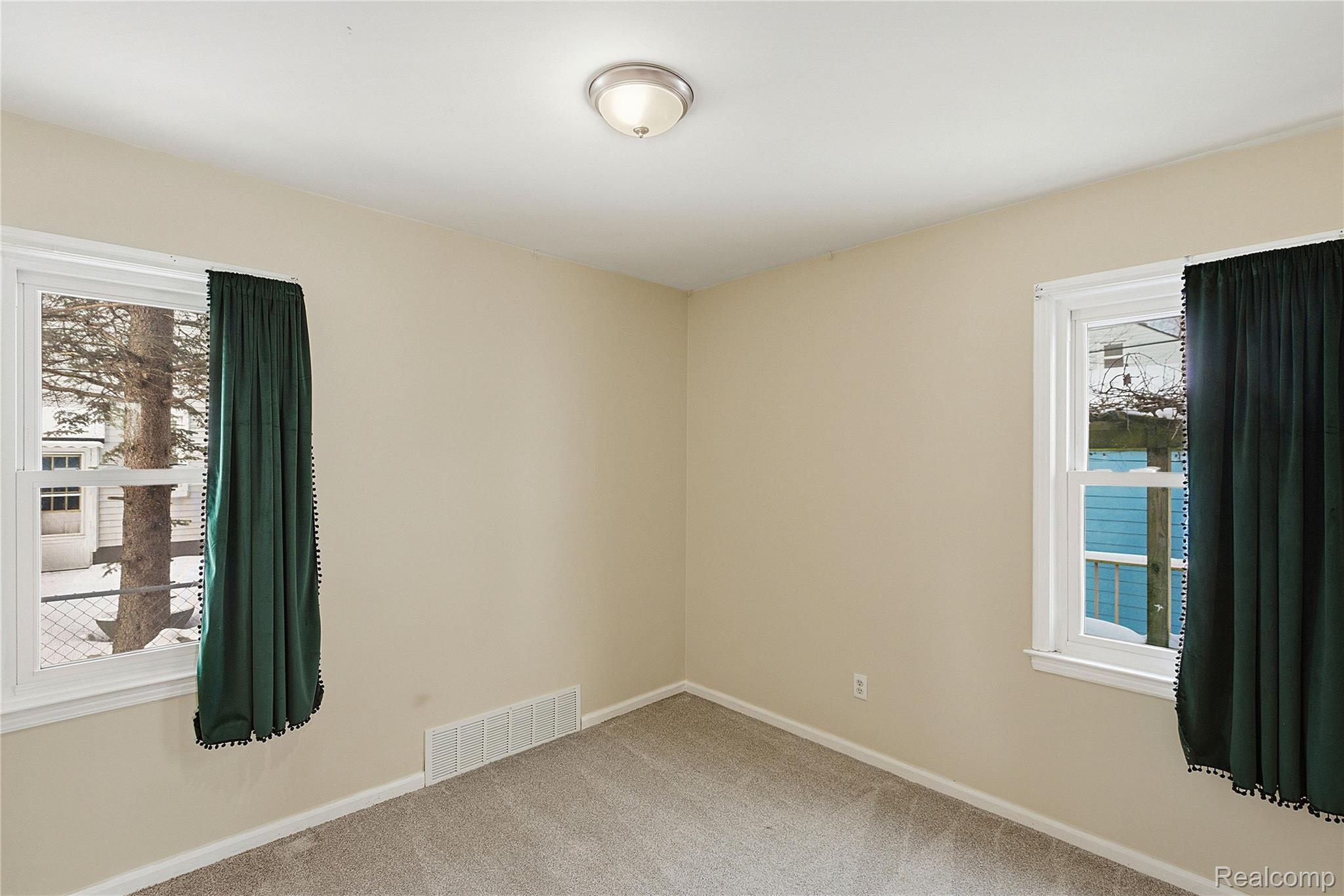 26104 Student Street Redford, MI 48239 - Photo 13 of 30 Empty room featuring carpet flooring and baseboards