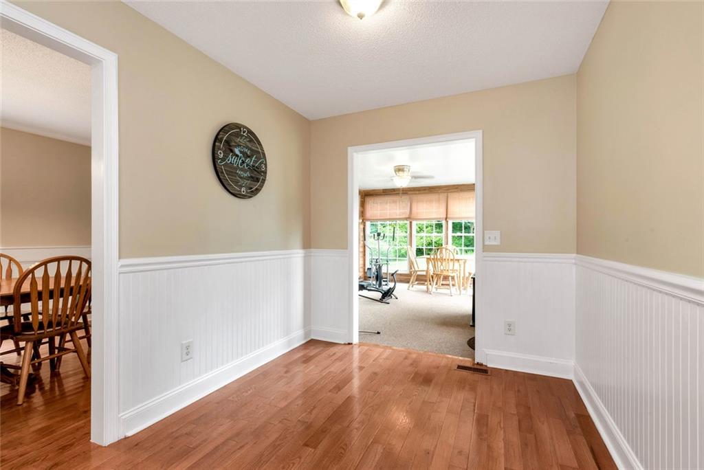 1044 Lothridge Road Cleveland, GA 30528 - Photo 19 of 40 an empty room with wooden floor and windows