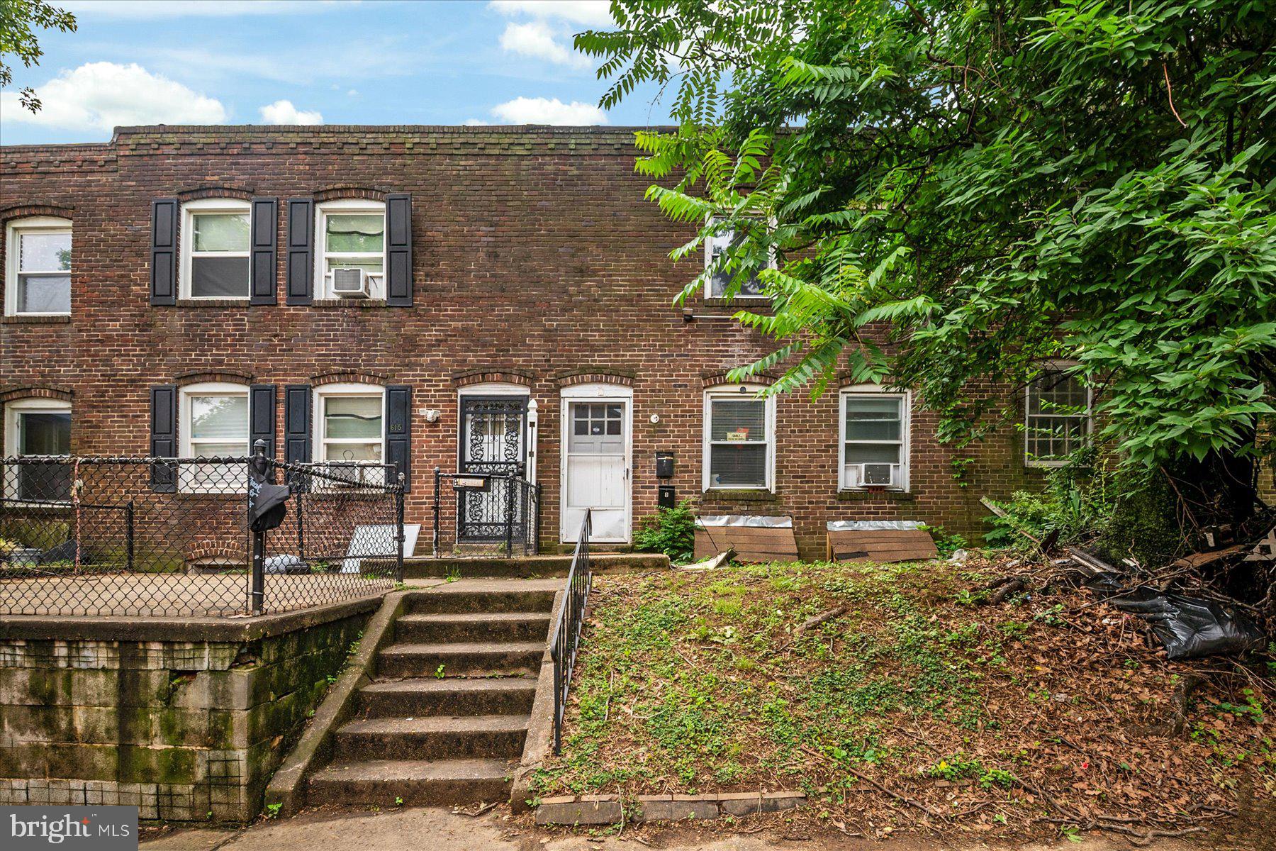 613 Baltic Avenue Baltimore, MD 21225 - Photo 4 of 6 a front view of a house with a yard