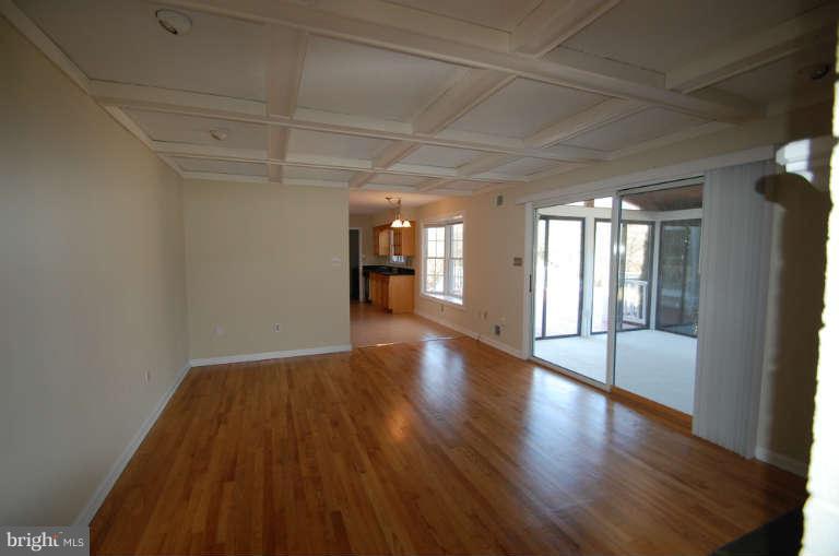 1904 Ednor Road Silver Spring, MD 20905 - Photo 10 of 30 a view of an empty room with wooden floor and a window