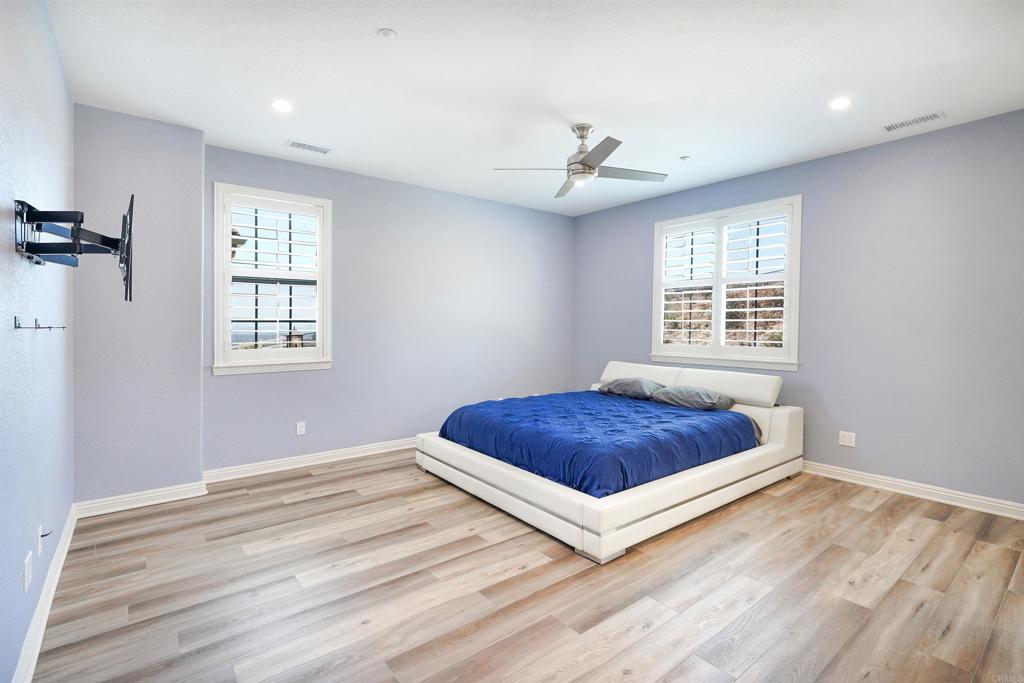 22963 Stokes Road Ramona, CA 92065 - Photo 34 of 57 a bedroom with a bed and a window