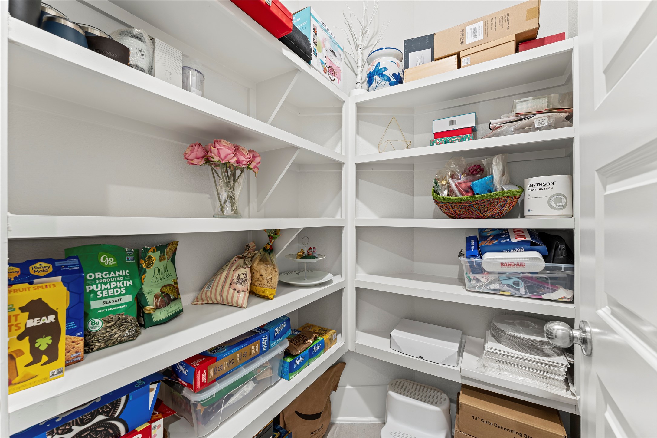 8815 Iron Forge Road Missouri City, TX 77459 - Photo 14 of 40 a shelf with books and knick knacks on it