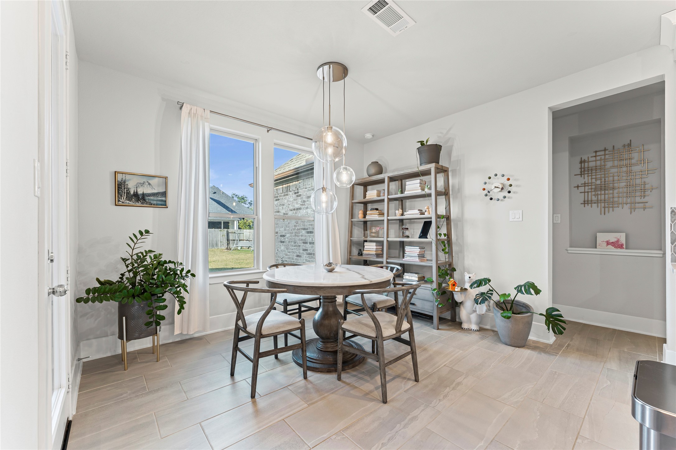 8815 Iron Forge Road Missouri City, TX 77459 - Photo 15 of 40 a view of a dining room with furniture window and wooden floor