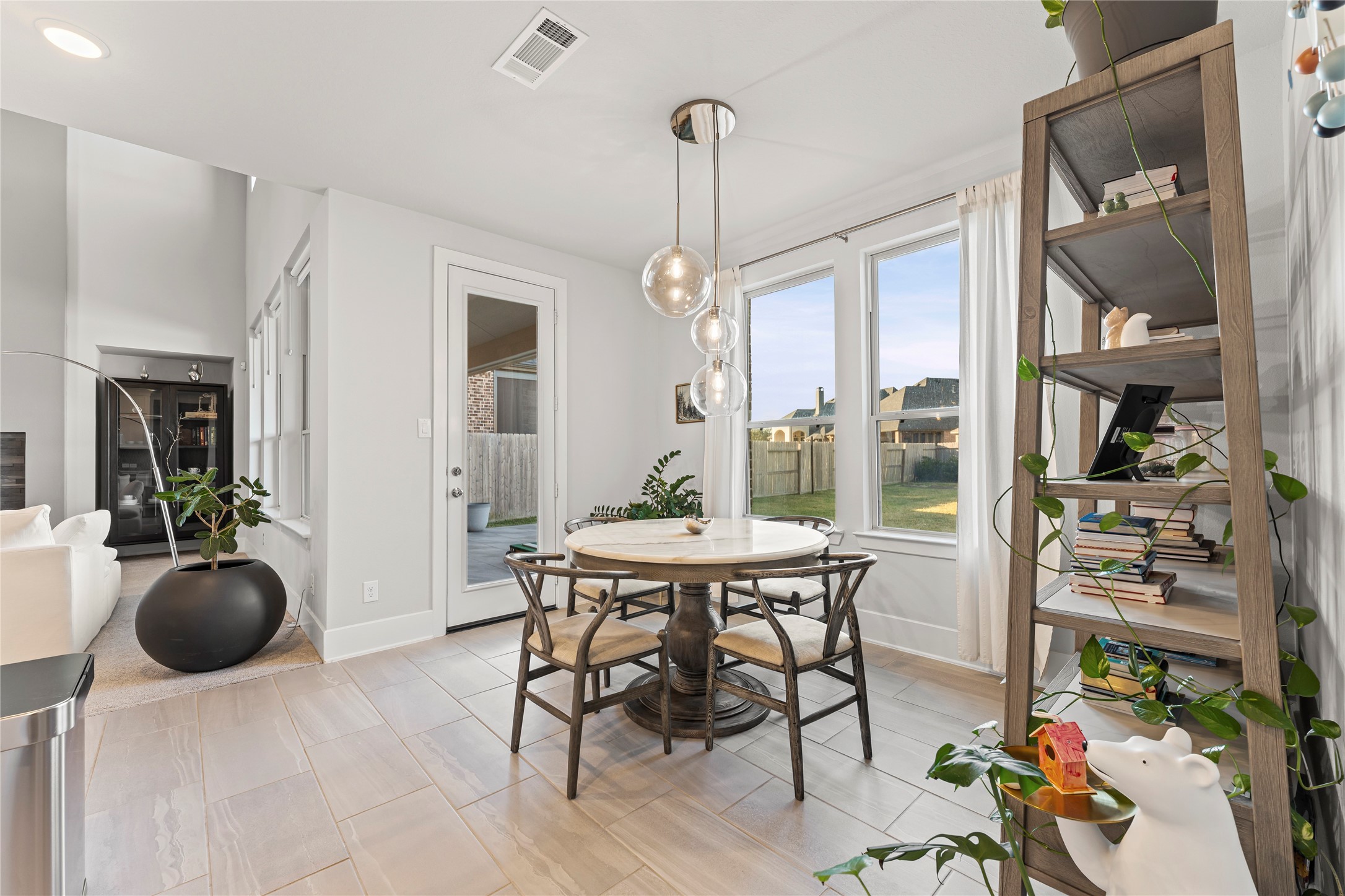 8815 Iron Forge Road Missouri City, TX 77459 - Photo 16 of 40 a view of a dining room with furniture window and outside view