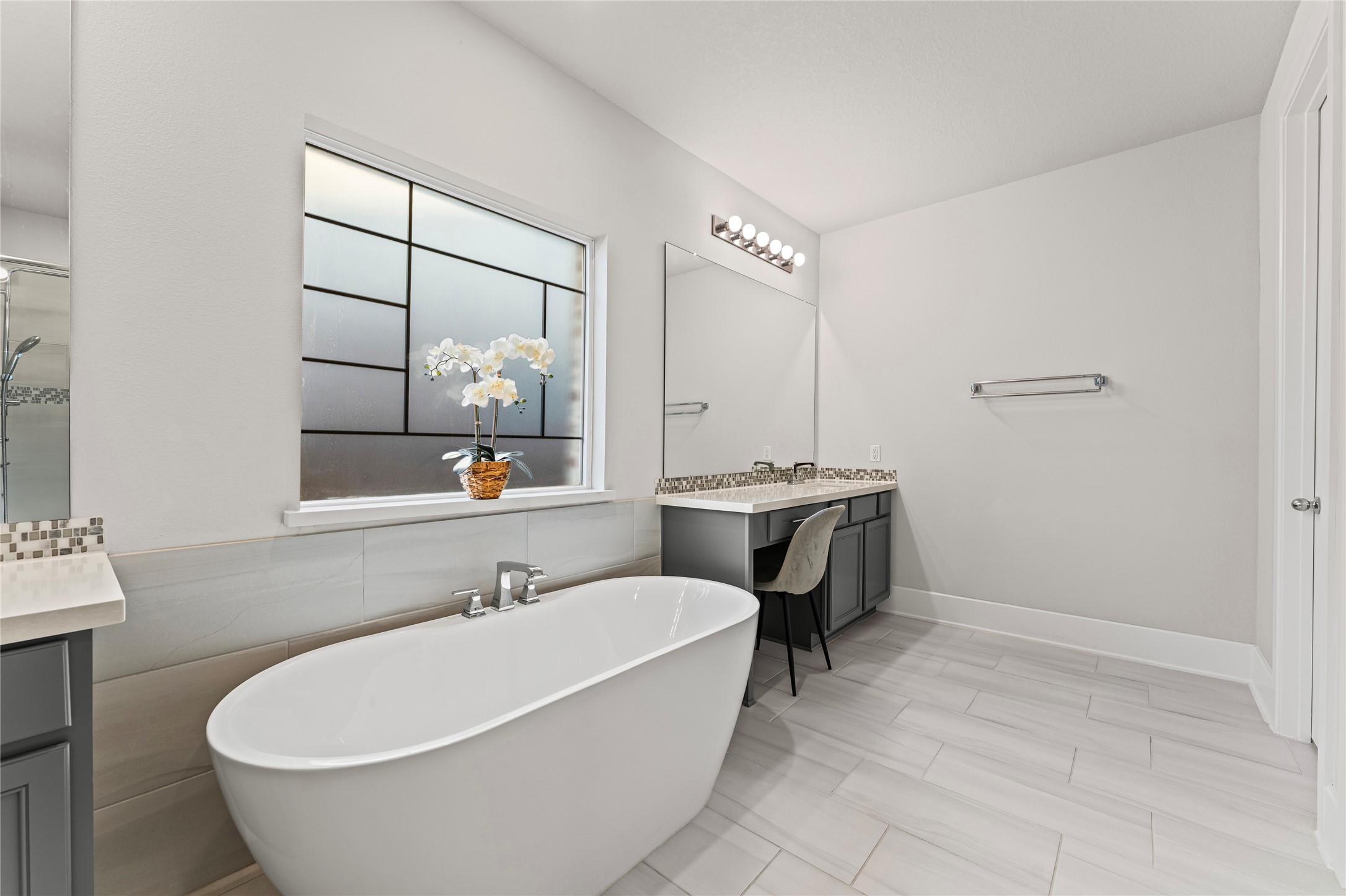 8815 Iron Forge Road Missouri City, TX 77459 - Photo 20 of 40 a white bath tub sitting next to a white sink