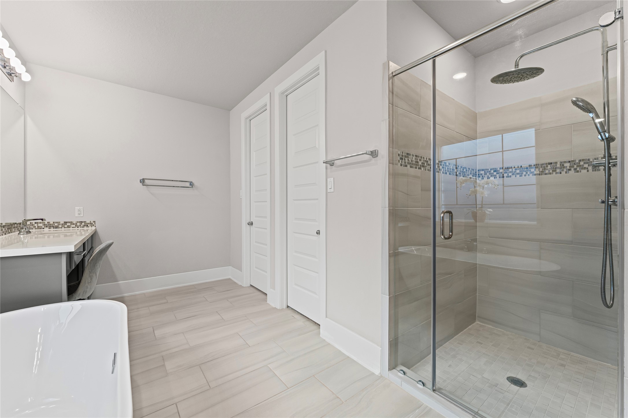 8815 Iron Forge Road Missouri City, TX 77459 - Photo 21 of 40 a bathroom with a shower and a sink