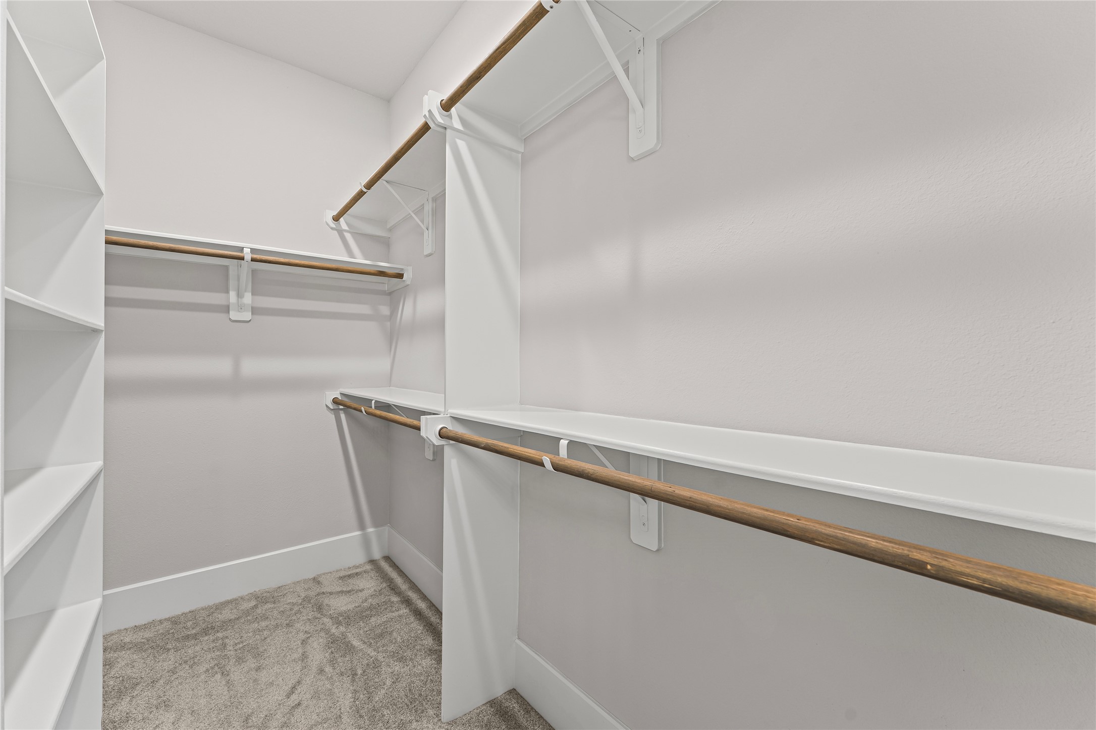 8815 Iron Forge Road Missouri City, TX 77459 - Photo 22 of 40 a view of closet with wooden floor