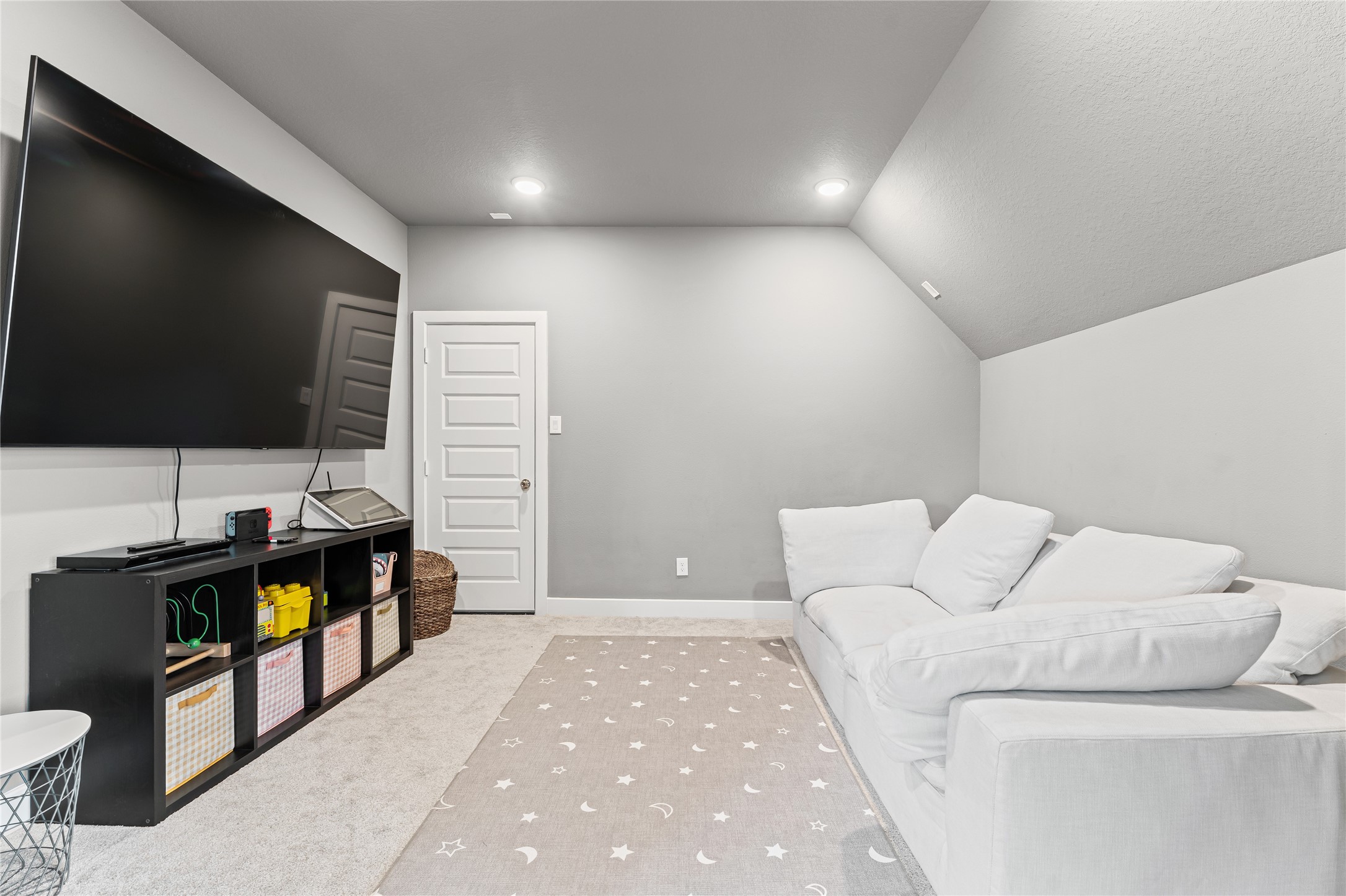 8815 Iron Forge Road Missouri City, TX 77459 - Photo 30 of 40 a living room with furniture and a flat screen tv