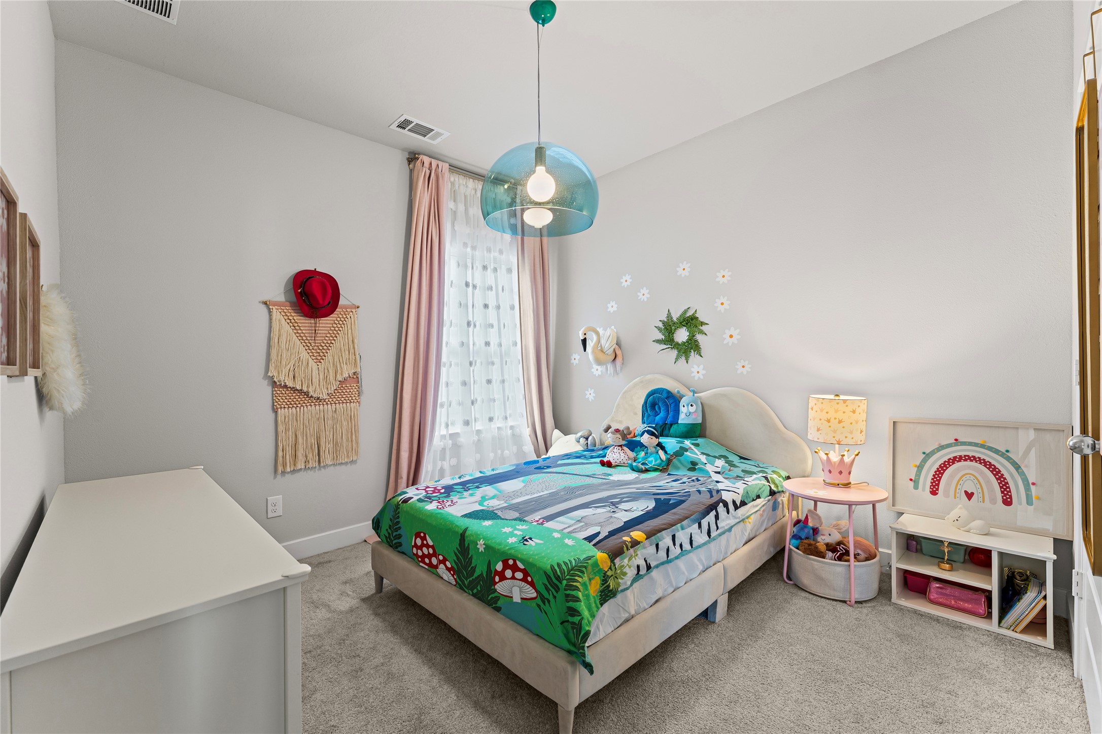 8815 Iron Forge Road Missouri City, TX 77459 - Photo 32 of 40 a bedroom with bed and a chandelier