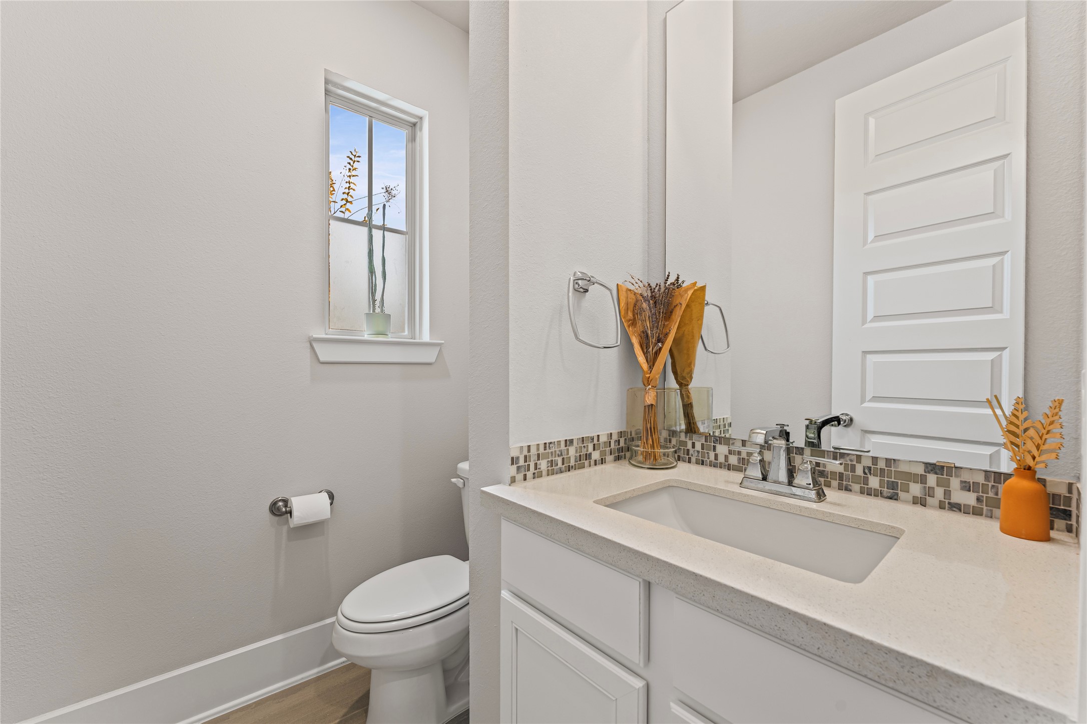 8815 Iron Forge Road Missouri City, TX 77459 - Photo 33 of 40 a bathroom with a granite countertop sink a toilet and a mirror