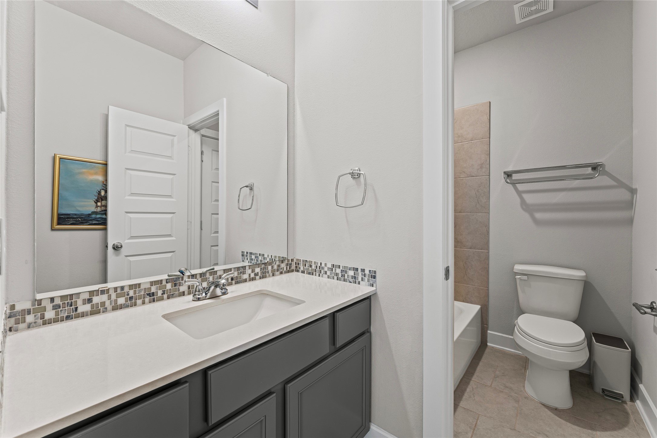 8815 Iron Forge Road Missouri City, TX 77459 - Photo 35 of 40 a bathroom with a sink toilet and mirror