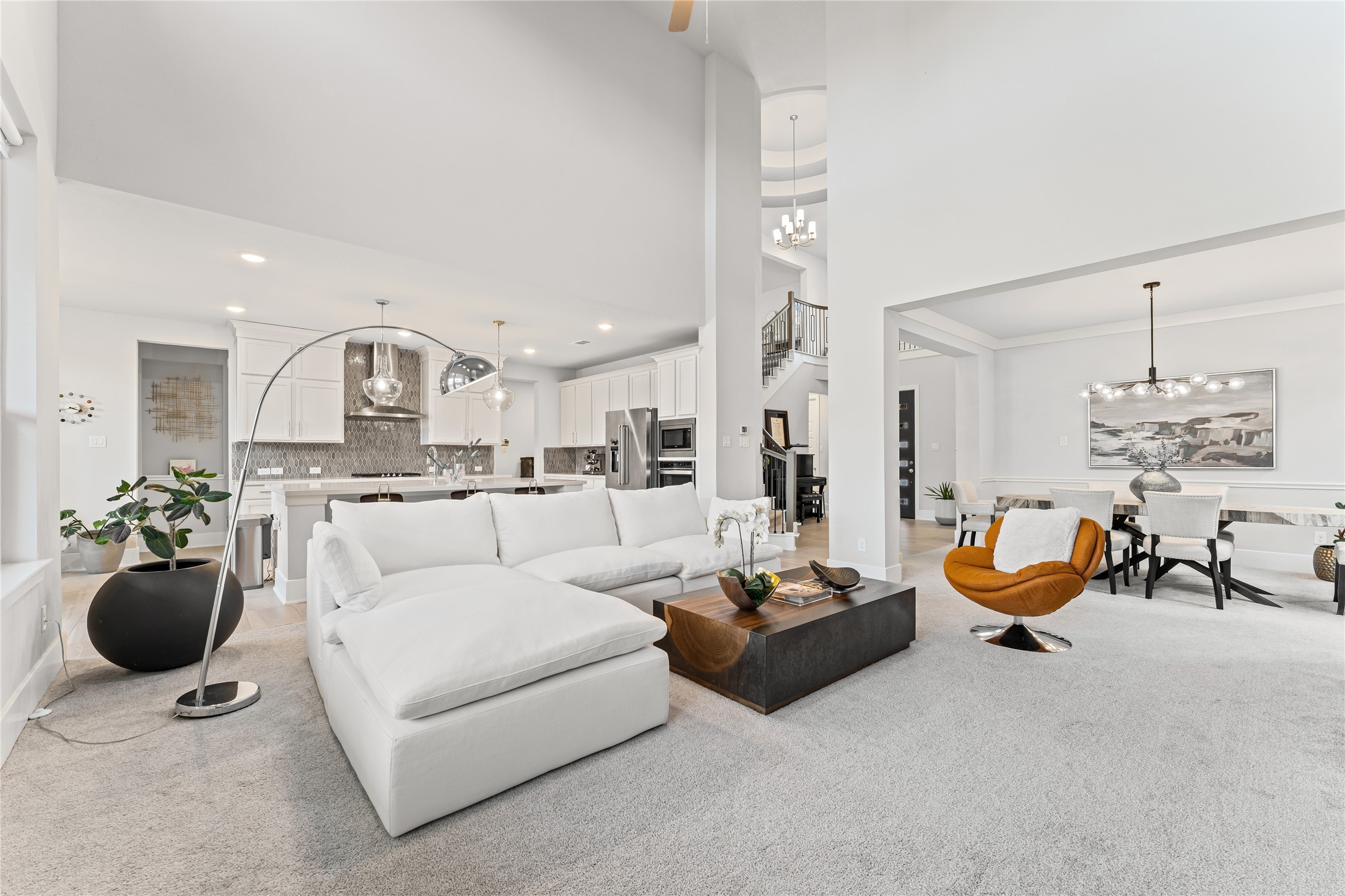 8815 Iron Forge Road Missouri City, TX 77459 - Photo 5 of 40 a living room with furniture and a chandelier