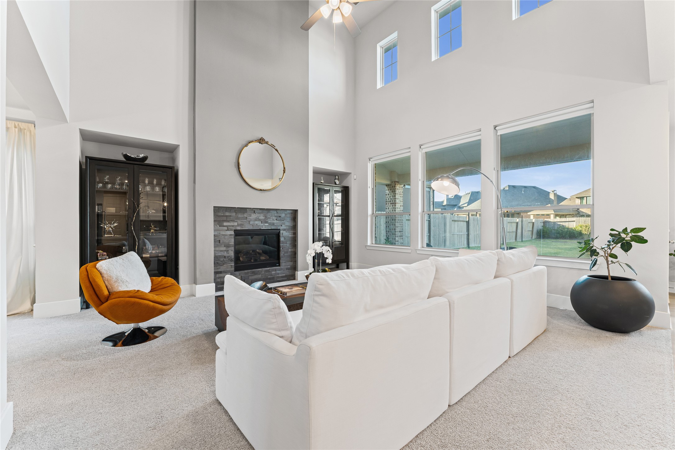 8815 Iron Forge Road Missouri City, TX 77459 - Photo 6 of 40 a living room with furniture a fireplace and a large window