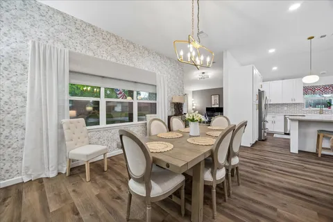 a view of a dining room with furniture window and outside view