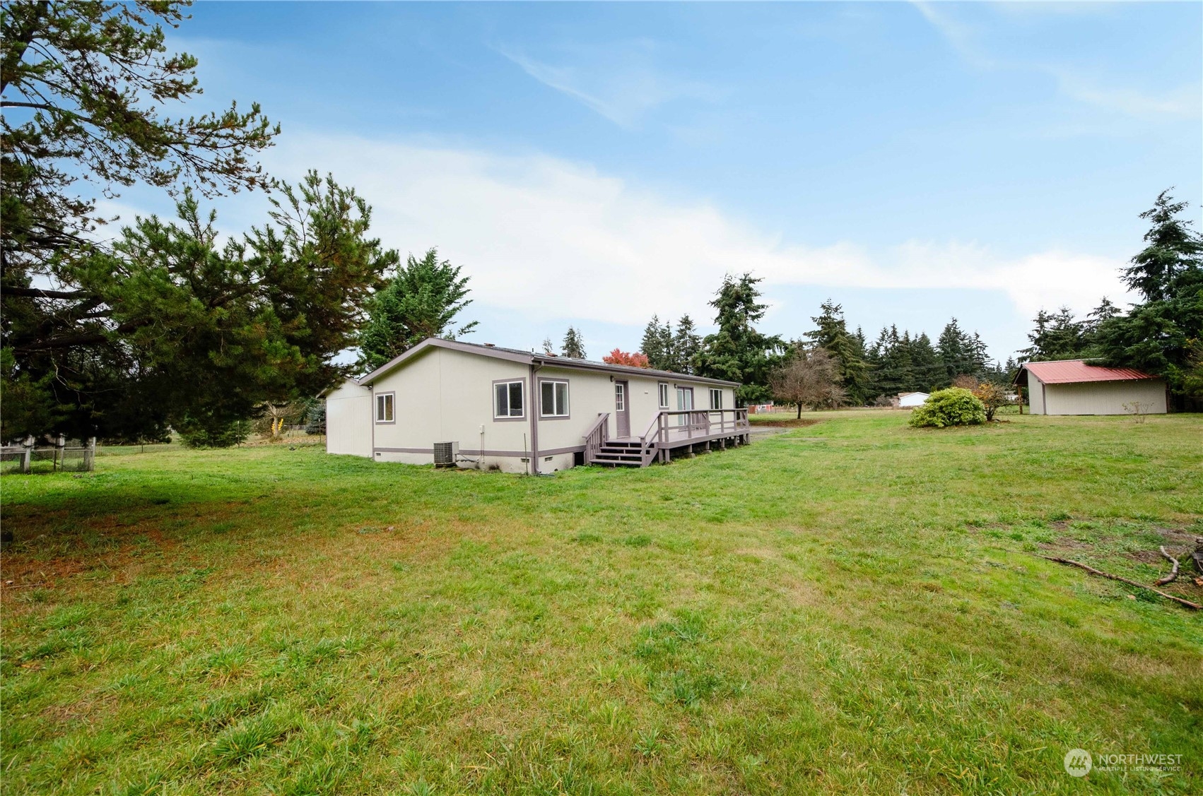 8827 173rd Avenue Southwest Rochester, WA 98579 - Photo 1 of 15 a view of a house with backyard and garden