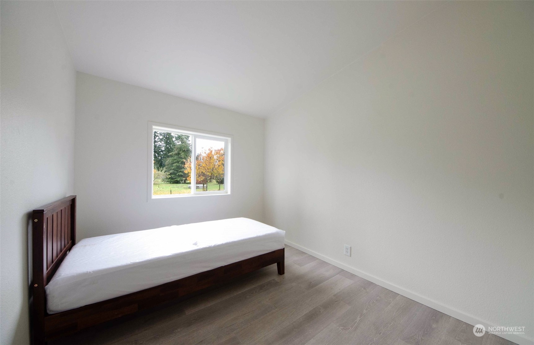 8827 173rd Avenue Southwest Rochester, WA 98579 - Photo 11 of 15 a bedroom with a bed and window
