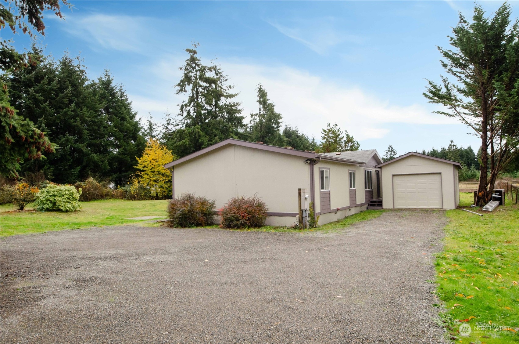 8827 173rd Avenue Southwest Rochester, WA 98579 - Photo 2 of 15 a view of a house with backyard and trees