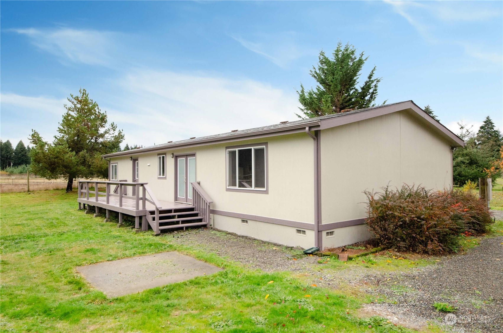 8827 173rd Avenue Southwest Rochester, WA 98579 - Photo 3 of 15 a view of a house with a yard and sitting area