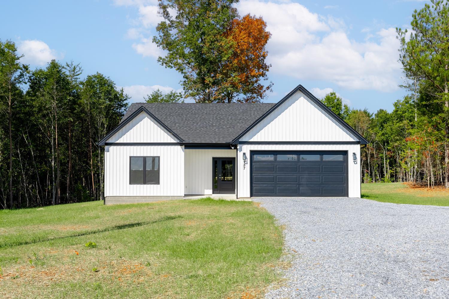 757 Down Creek Road Brookneal, VA 24528 - Photo 1 of 49 a front view of a house with yard and garage