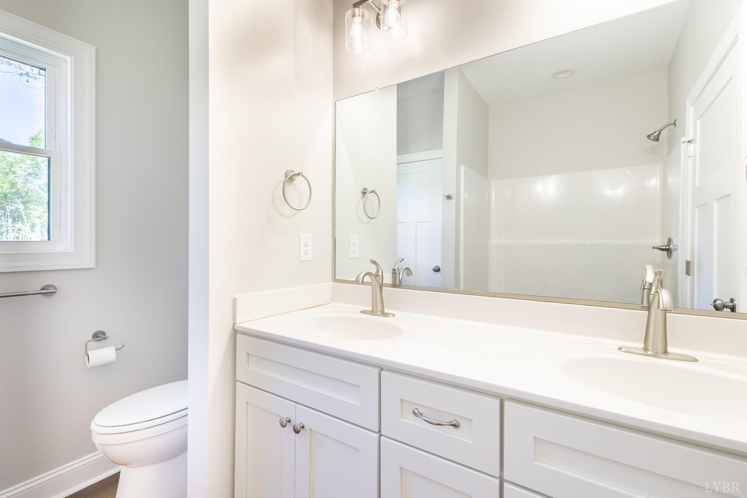 757 Down Creek Road Brookneal, VA 24528 - Photo 18 of 49 a bathroom with a sink and a mirror