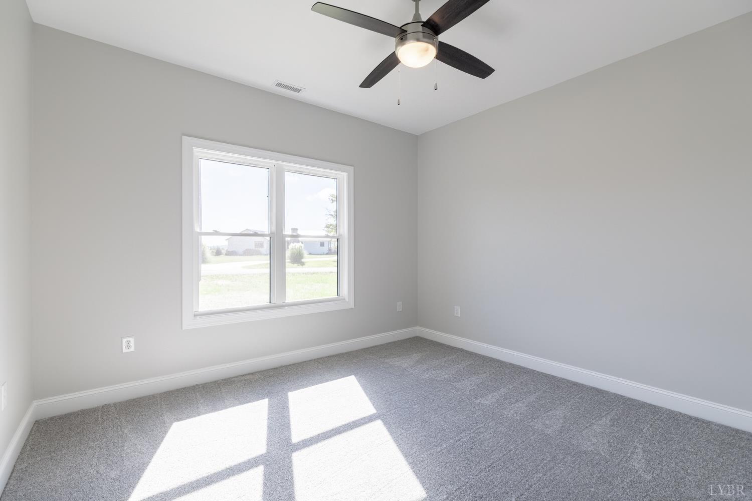 757 Down Creek Road Brookneal, VA 24528 - Photo 20 of 49 an empty room with a window