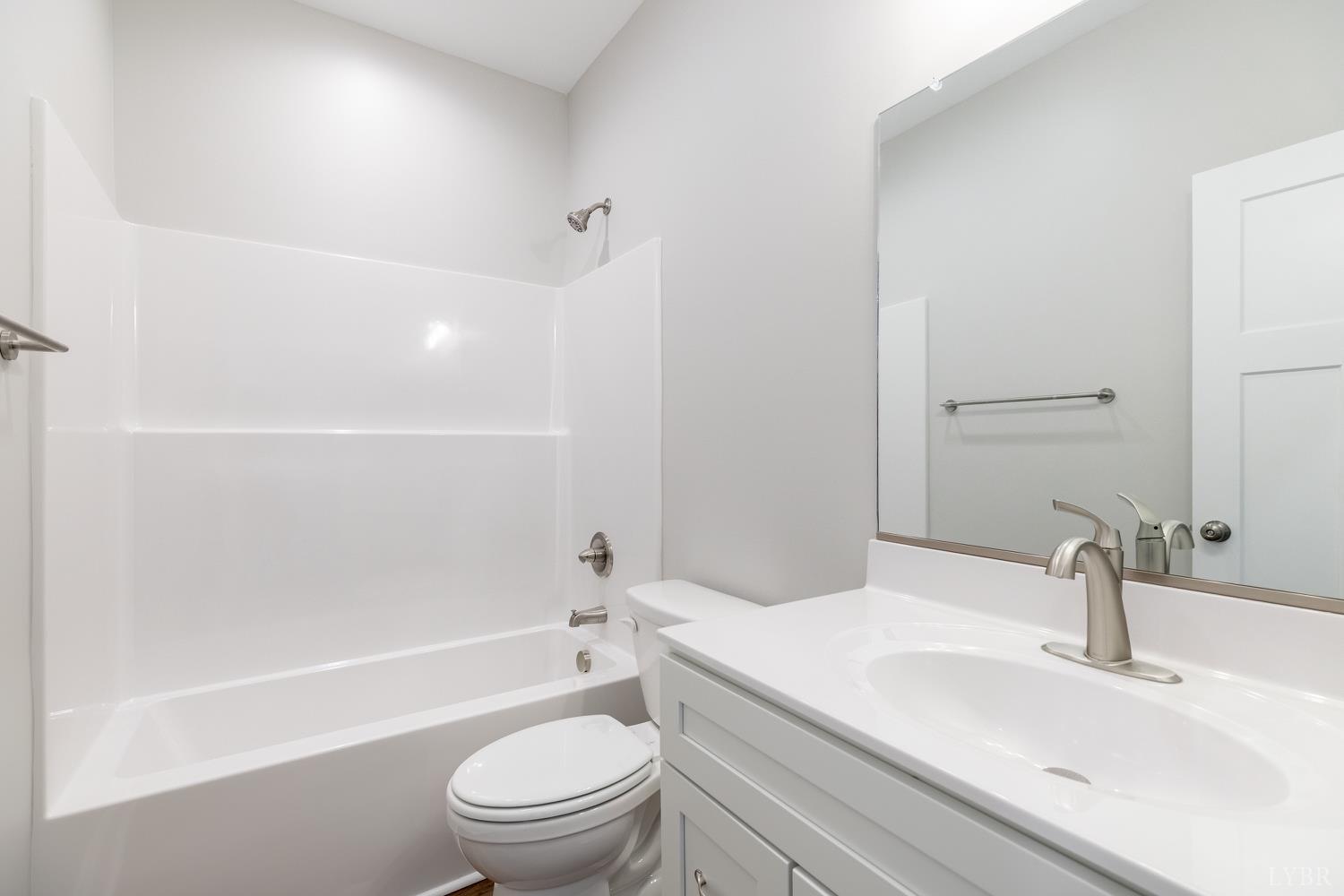 757 Down Creek Road Brookneal, VA 24528 - Photo 23 of 49 a bathroom with a sink a toilet and a bathtub