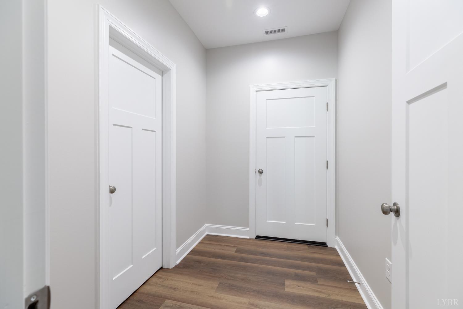 757 Down Creek Road Brookneal, VA 24528 - Photo 27 of 49 a view of a hallway with wooden floor