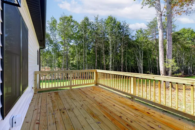 a view of a balcony with wooden floor