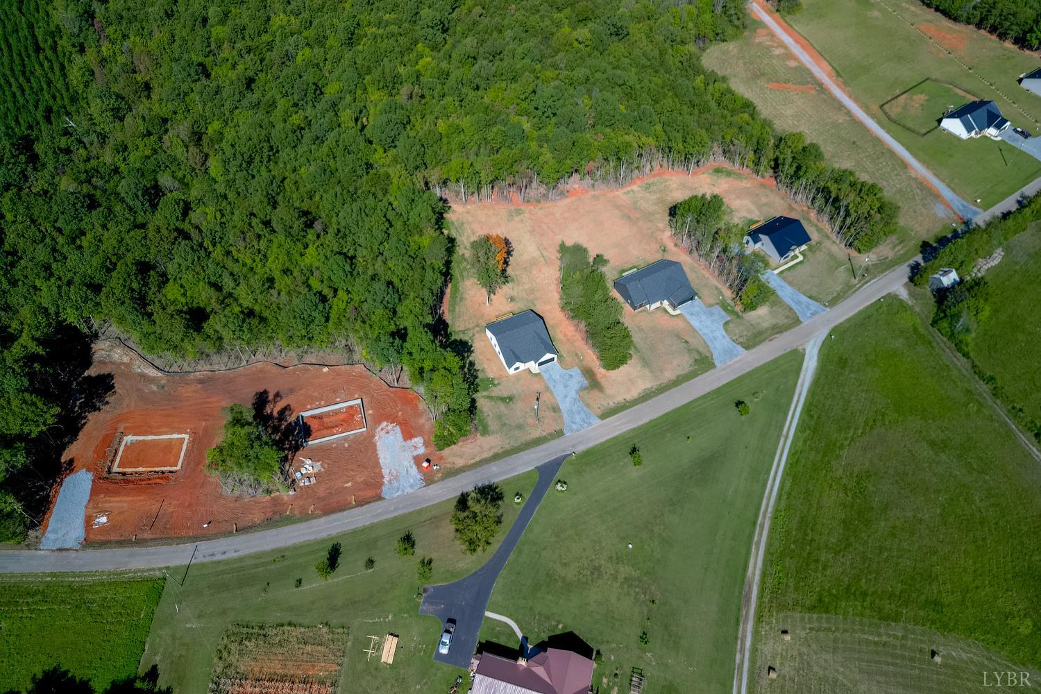 757 Down Creek Road Brookneal, VA 24528 - Photo 45 of 49 an aerial view of a house a yard and mountain view