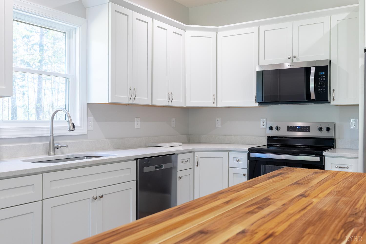 757 Down Creek Road Brookneal, VA 24528 - Photo 8 of 49 a kitchen with a sink and cabinets