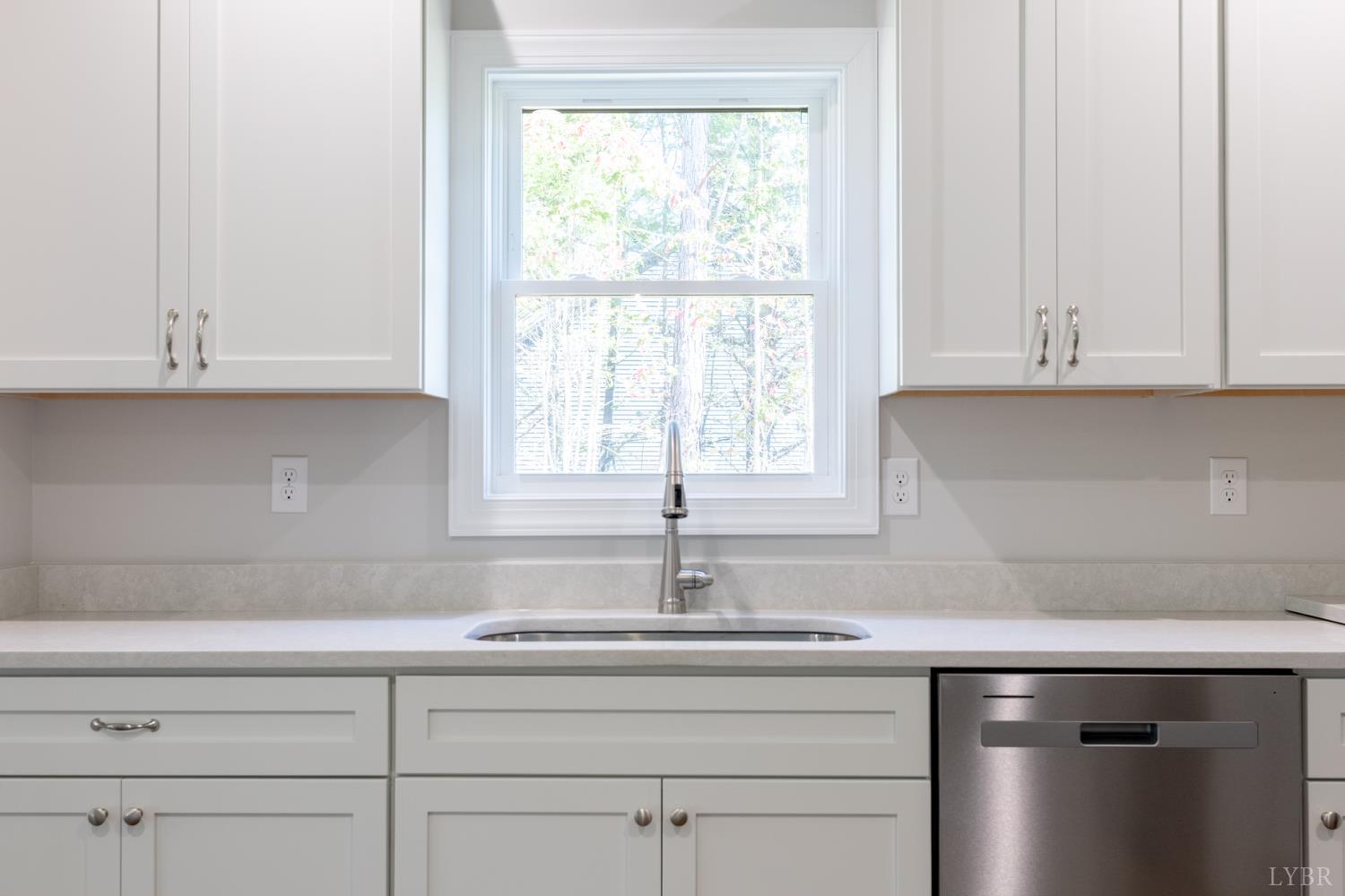 757 Down Creek Road Brookneal, VA 24528 - Photo 9 of 49 a kitchen with granite countertop white cabinets and a sink
