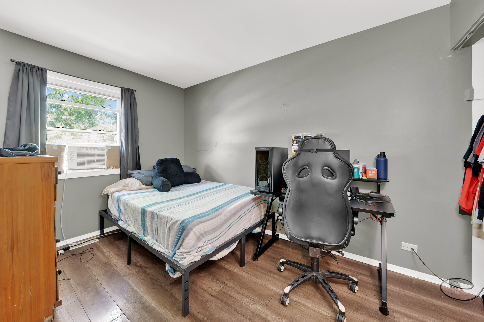 17303 Apple Tree Drive Hazel Crest, IL 60429 - Photo 14 of 23 a bedroom with a bed and a window