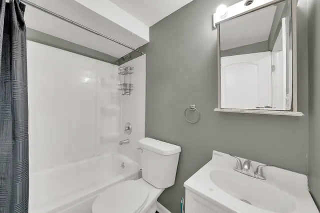 a bathroom with a sink toilet and bathtub