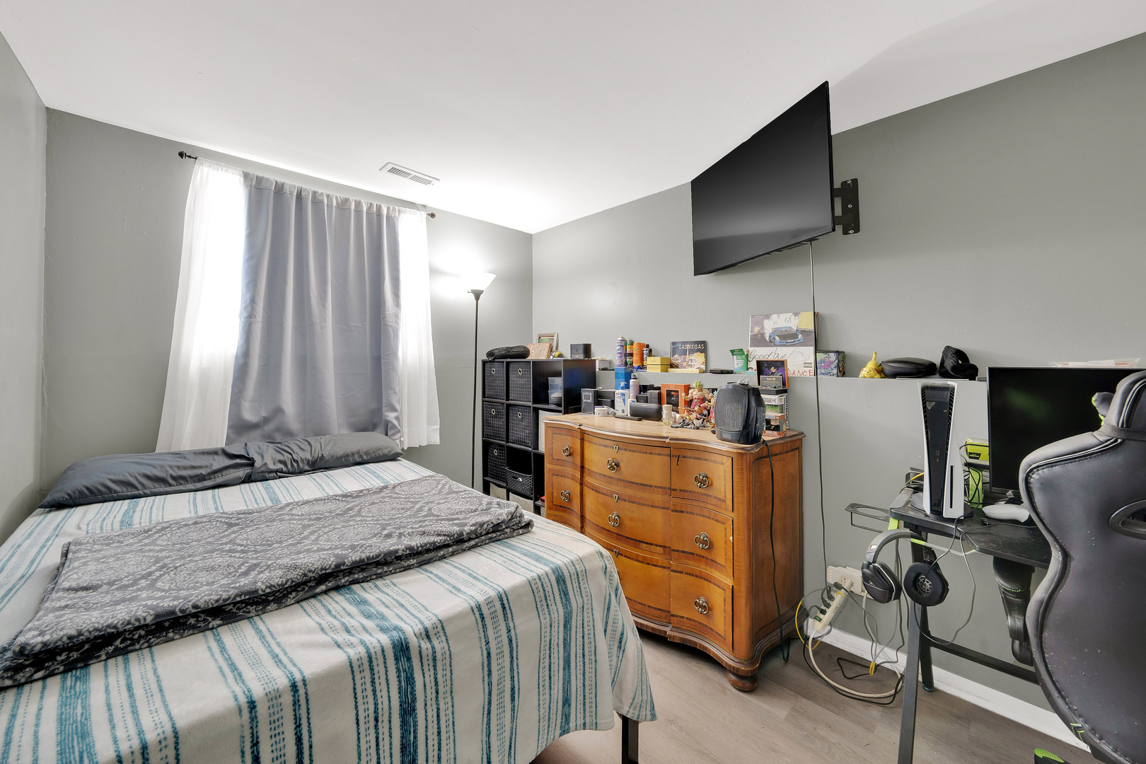 17303 Apple Tree Drive Hazel Crest, IL 60429 - Photo 22 of 23 a bedroom with a bed and a flat screen tv