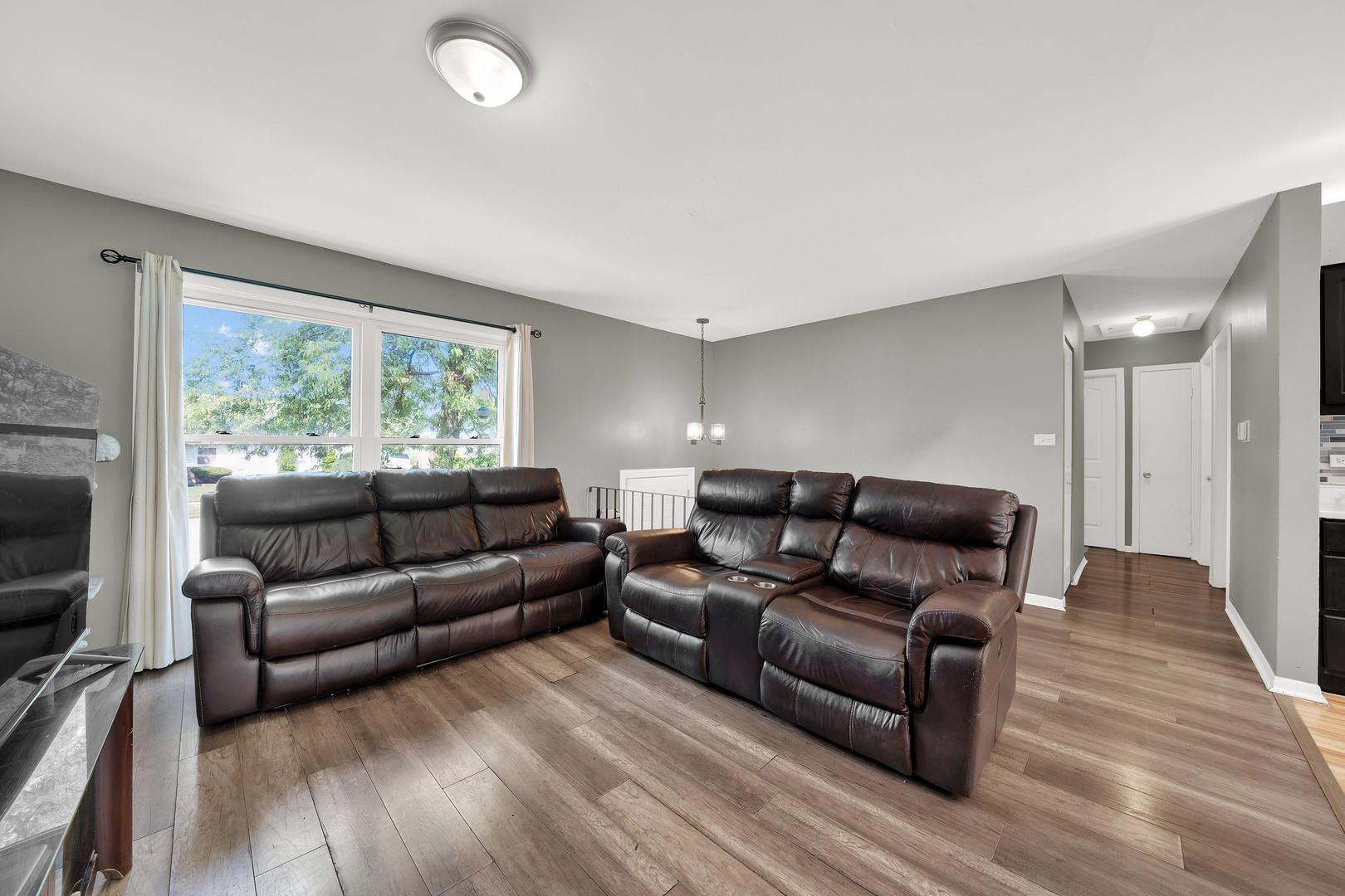 17303 Apple Tree Drive Hazel Crest, IL 60429 - Photo 6 of 23 a living room with furniture and a large window