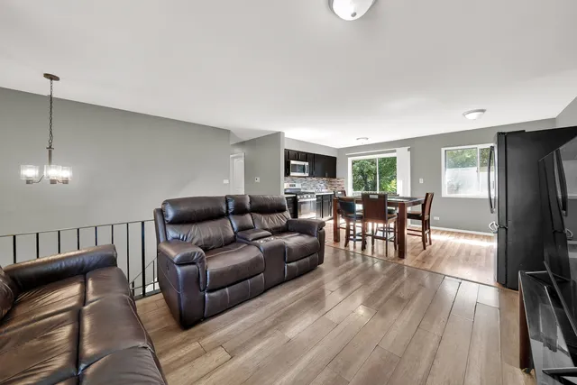 a living room with furniture and a table
