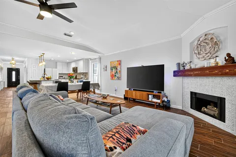 a view of a workspace with furniture and wooden floor