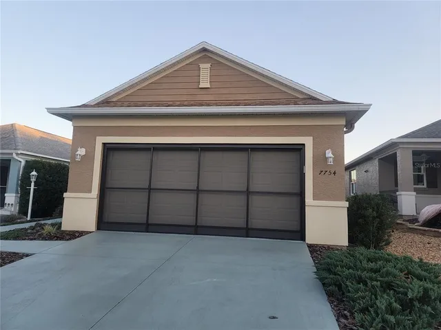 a front view of a house with a garage