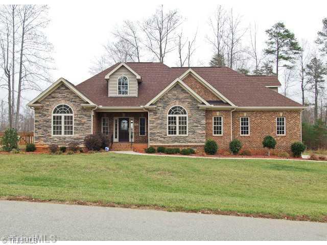 8450 Alice Player Drive Oak Ridge, NC 27310 - Photo 1 of 16 Exterior Front.